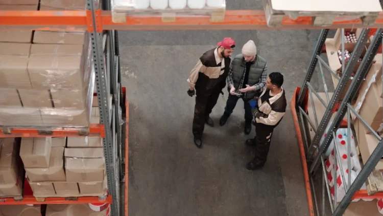Image of industrial workers in a warehouse.